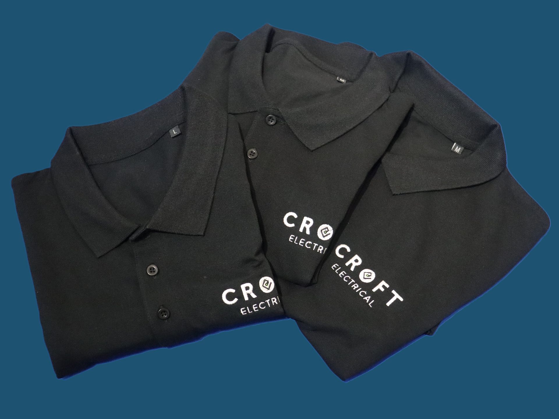 3 polo shirts embroidered with Croft Electrical's logo